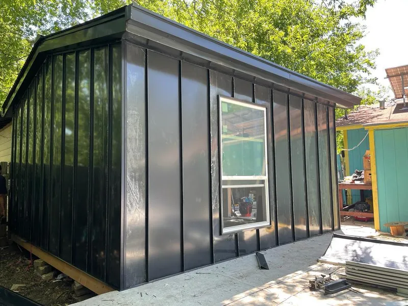 Black standing seam metal wall panels for Roof Inspection in Jamestown